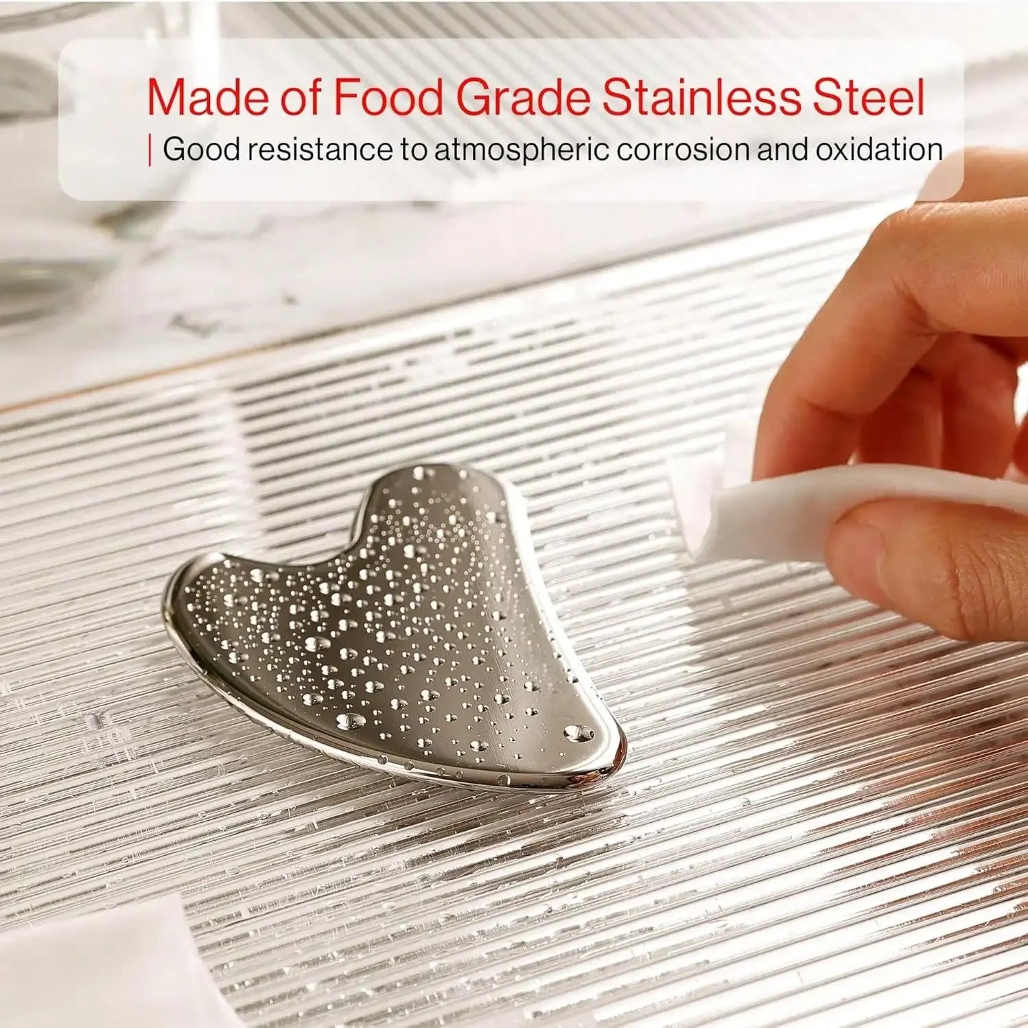 Metallic tool on a textured surface with text about food-grade stainless steel.